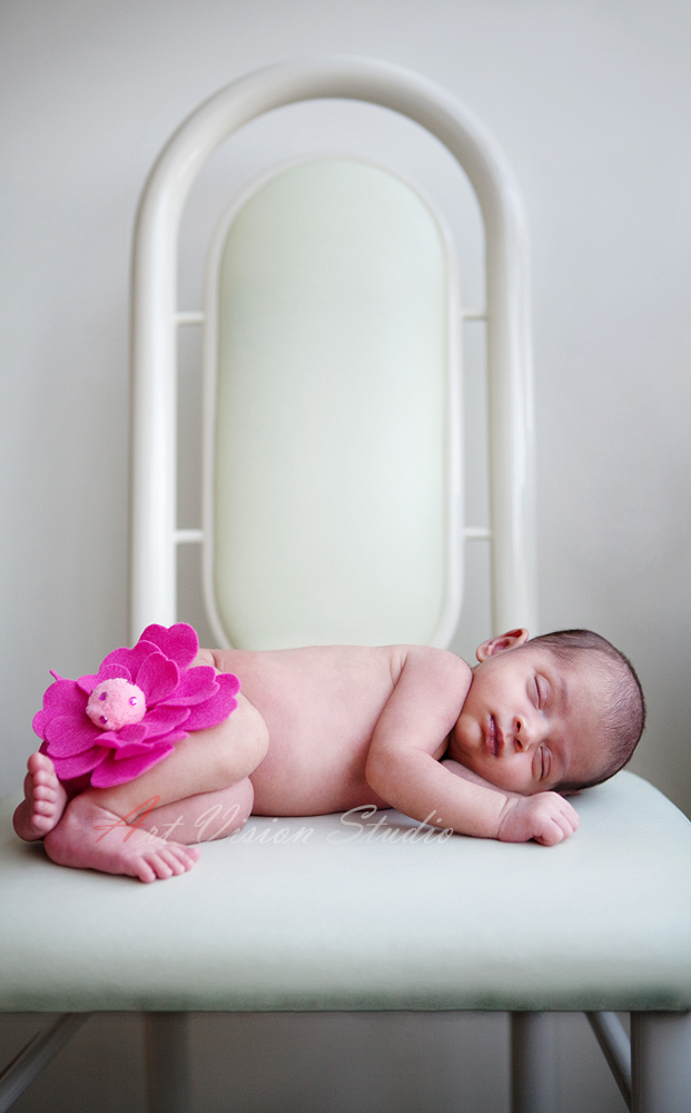 Stamford, CT, Photo of a newborn baby sleeping on a chair 
