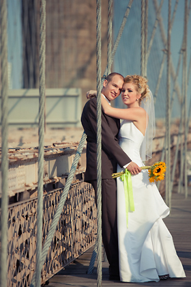 Posing on a bridge for a wedding session